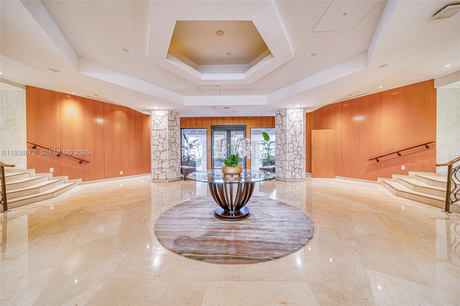1111 Crandon Boulevard, Unit C404 Key Biscayne, FL 33149 - Photo 4 of 44 a view of a living room with a flat screen tv
