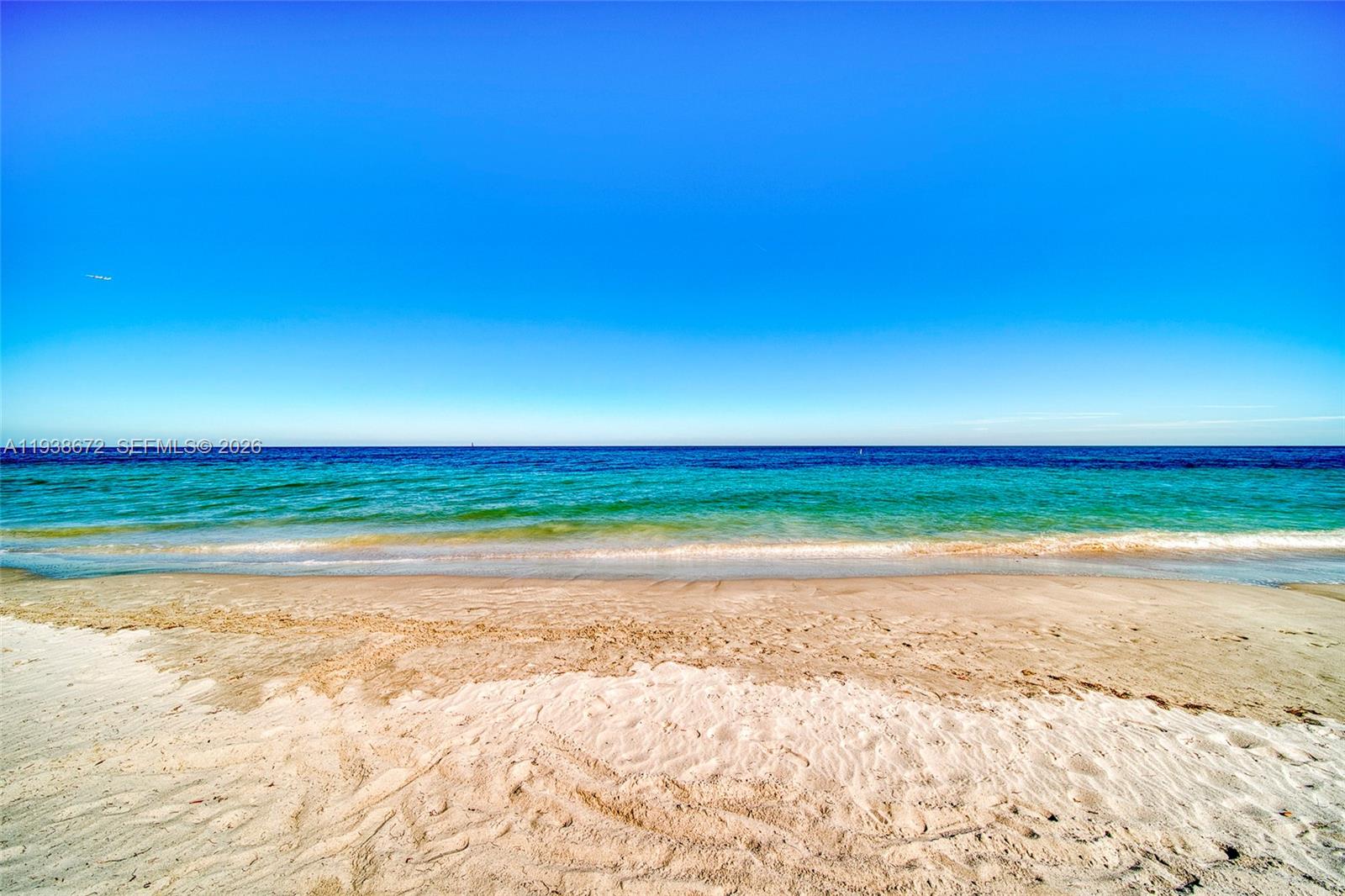 1111 Crandon Boulevard, Unit C404 Key Biscayne, FL 33149 - Photo 42 of 44 a sunset view with beach