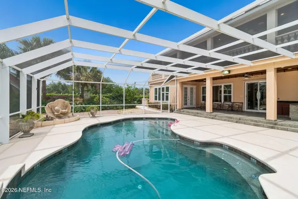 a view of swimming pool with seating area