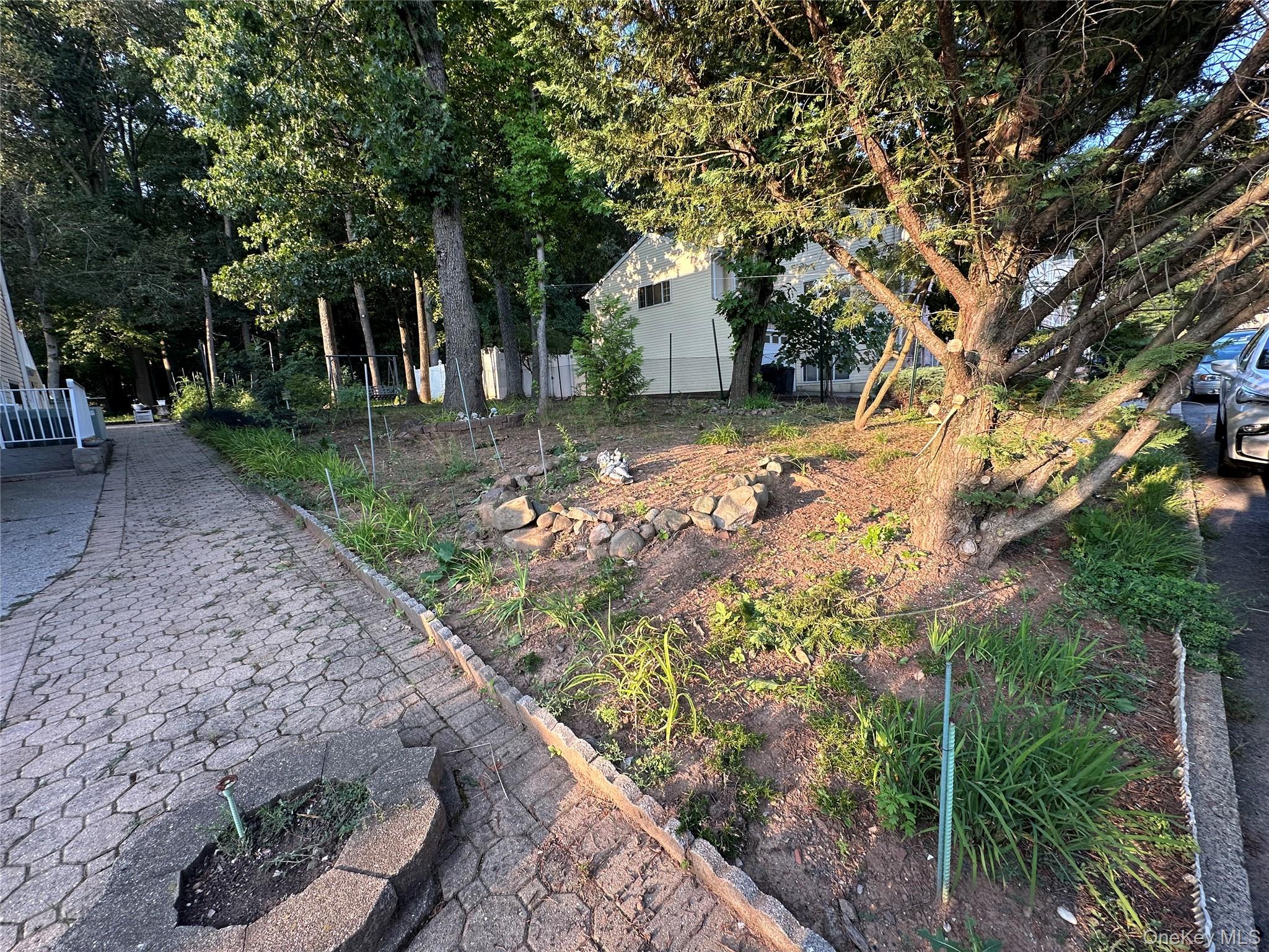 55 Quail Lane Staten Island, NY 10309 - Photo 4 of 4 a front view of a house with a yard