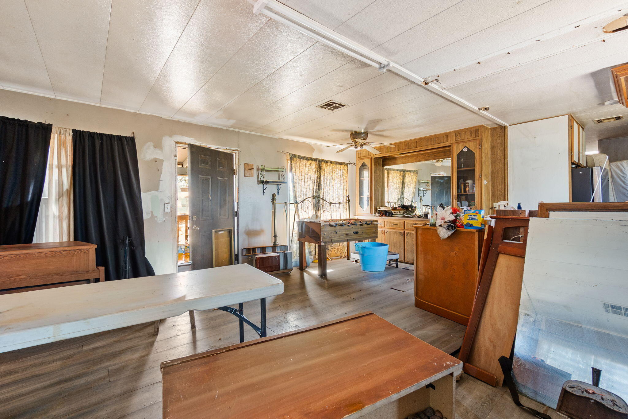 13957 Gas Point Road Igo, CA 96047 - Photo 4 of 18 a living room with lots of furniture and a view of kitchen