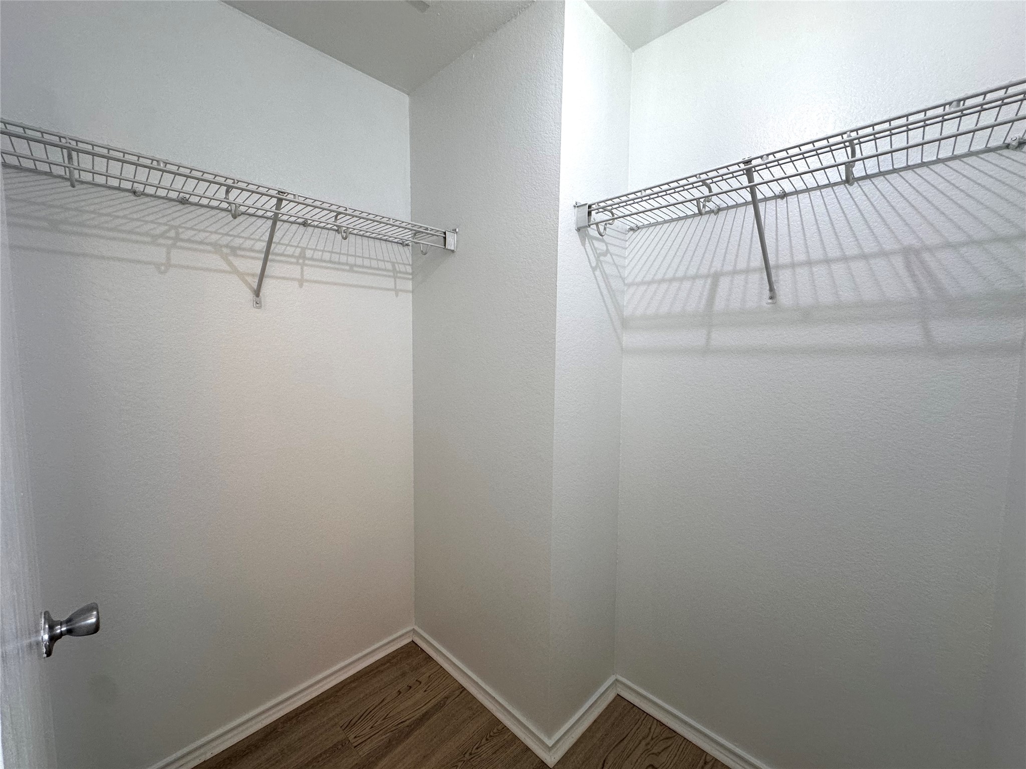 722 Lavaca Loop Elgin, TX 78621 - Photo 12 of 24 Walk in closet with dark wood finished floors