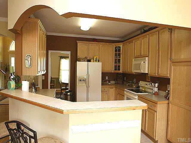 Wonderful kitchen with 42' cabinetry, corner view cabinet, eat-at bar, built in microwave, easy maintenance floors and wood trim countertops. Other