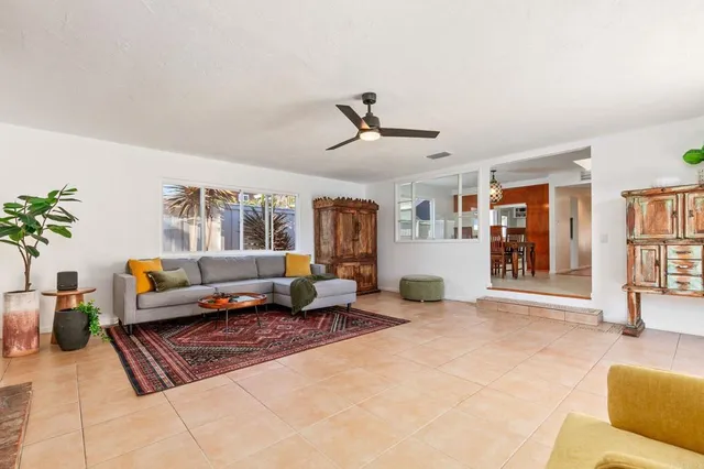 a bedroom with bed and wooden floor