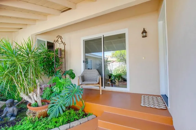 a view of a chairs and table in a patio