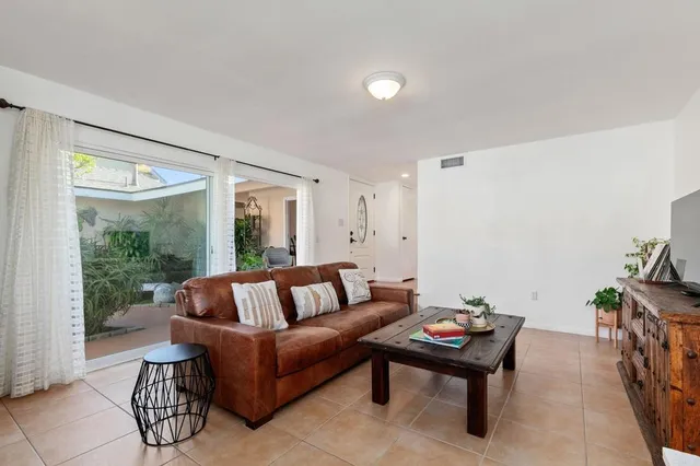 a kitchen with stainless steel appliances granite countertop wooden cabinets a stove and a sink