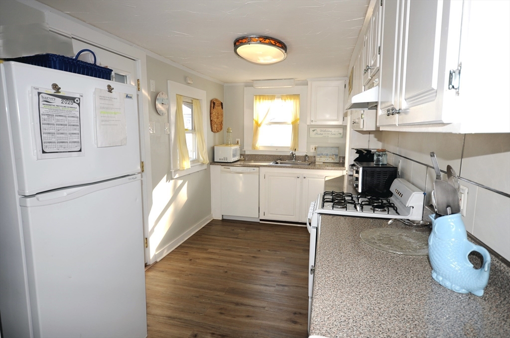 1 Circle Drive Wareham, MA 02571 - Photo 11 of 20 a kitchen with stainless steel appliances granite countertop a refrigerator and a sink