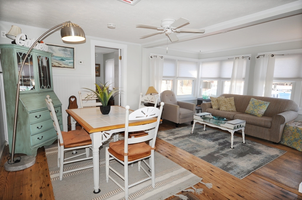 1 Circle Drive Wareham, MA 02571 - Photo 4 of 20 a living room with furniture a chandelier and a window