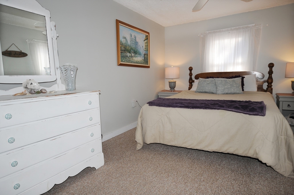 1 Circle Drive Wareham, MA 02571 - Photo 8 of 20 a spacious bedroom with a bed and a dresser