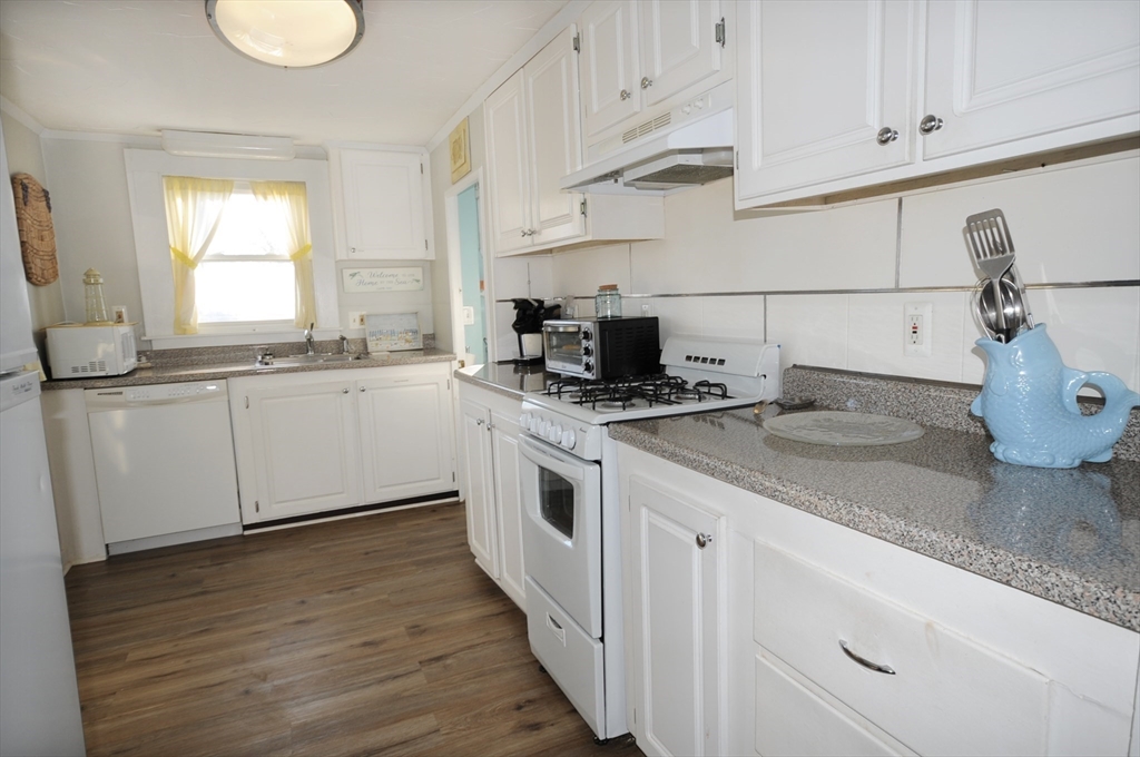 1 Circle Drive Wareham, MA 02571 - Photo 10 of 20 a kitchen with stainless steel appliances granite countertop a sink and a stove