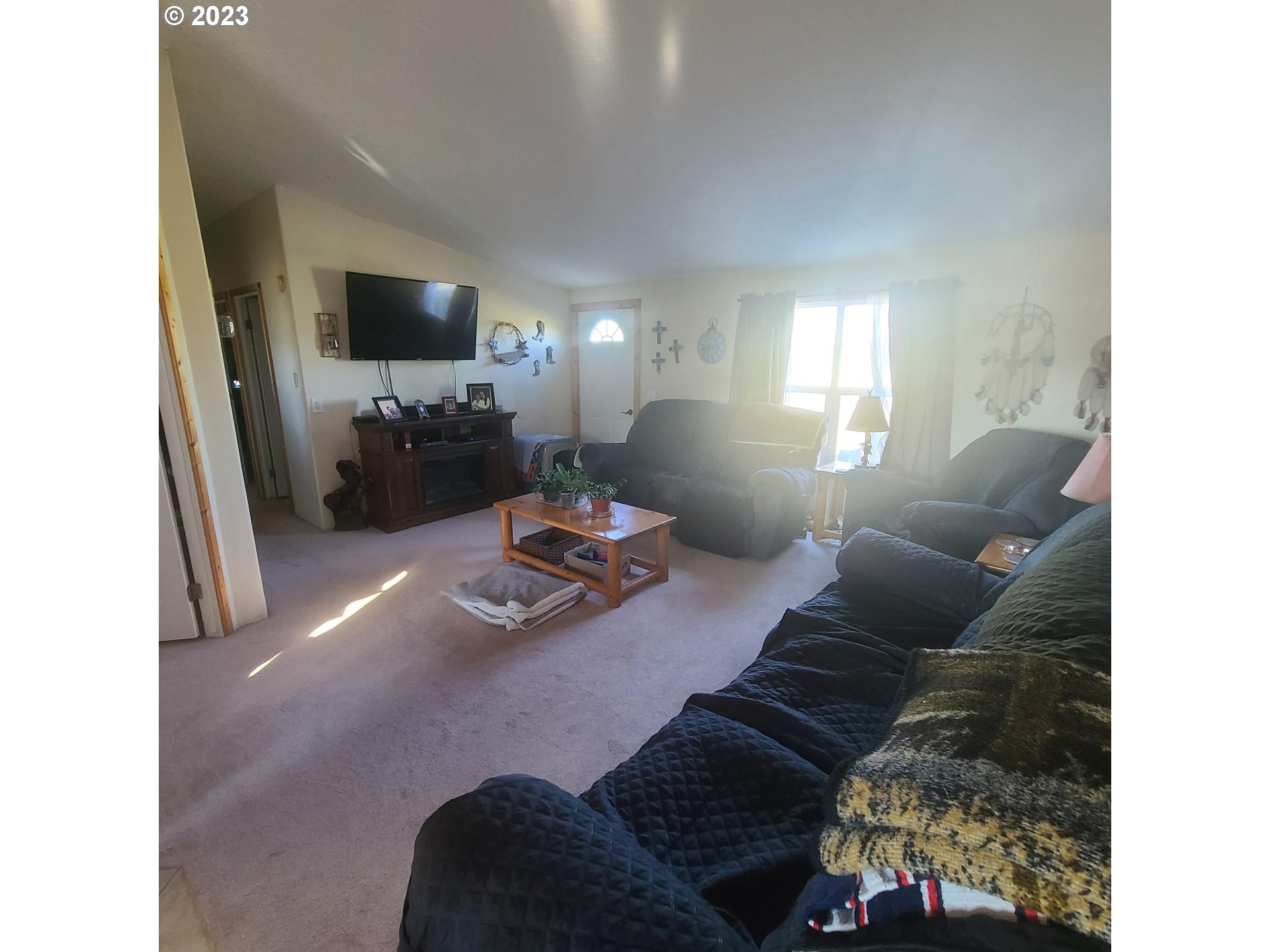 70775 Middle Road Elgin, OR 97827 - Photo 21 of 40 a living room with furniture and a flat screen tv