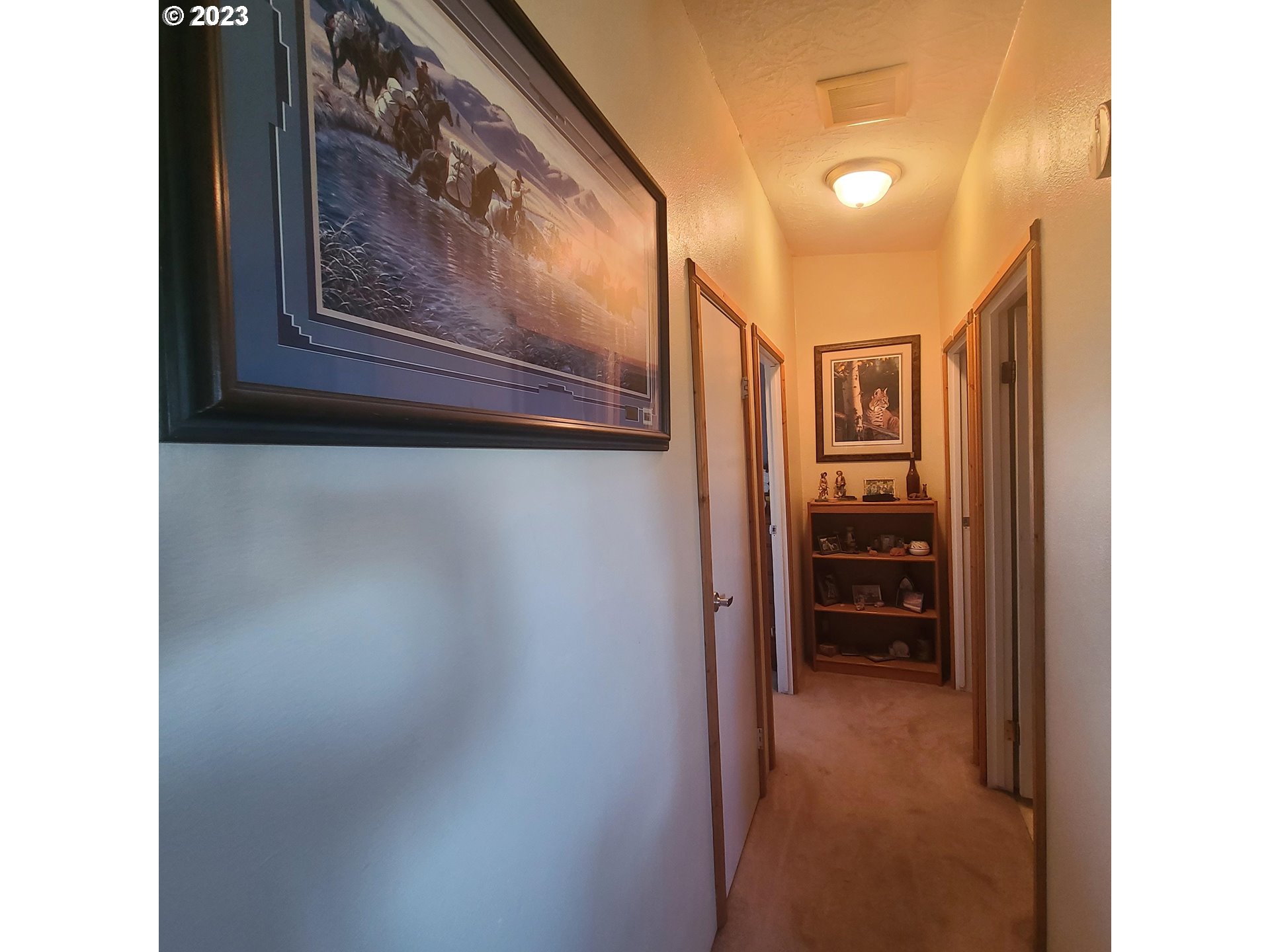 70775 Middle Road Elgin, OR 97827 - Photo 22 of 40 a view of a hallway and a dining area