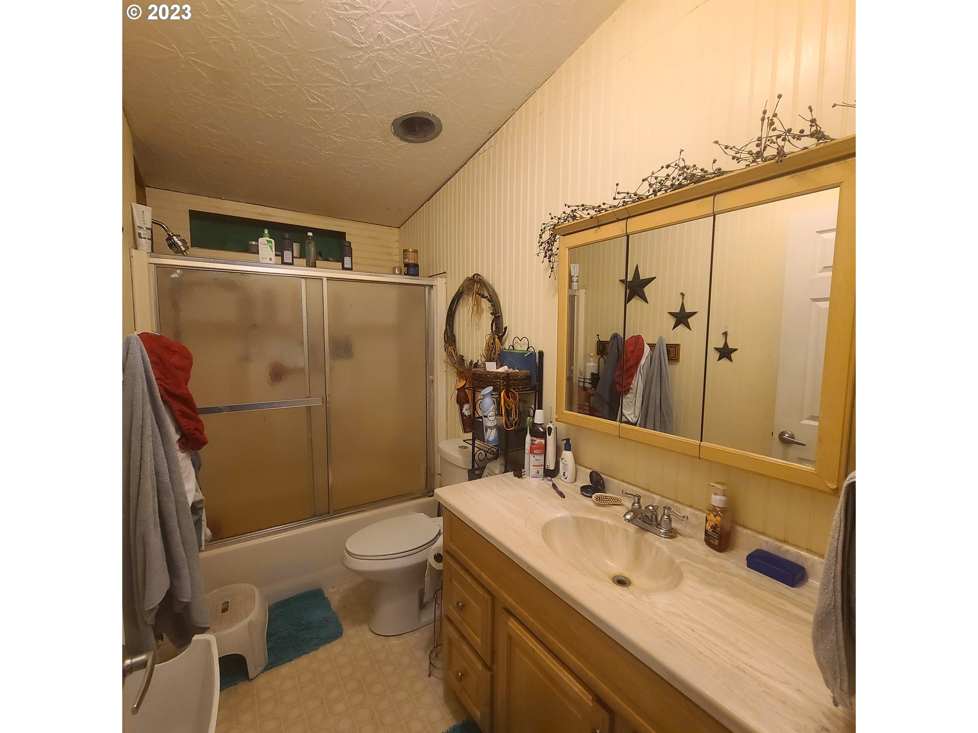 70775 Middle Road Elgin, OR 97827 - Photo 23 of 40 a bathroom with a sink mirror toilet and shower