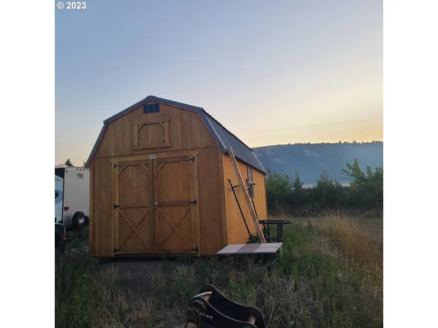 a view of an ocean beach and mountain