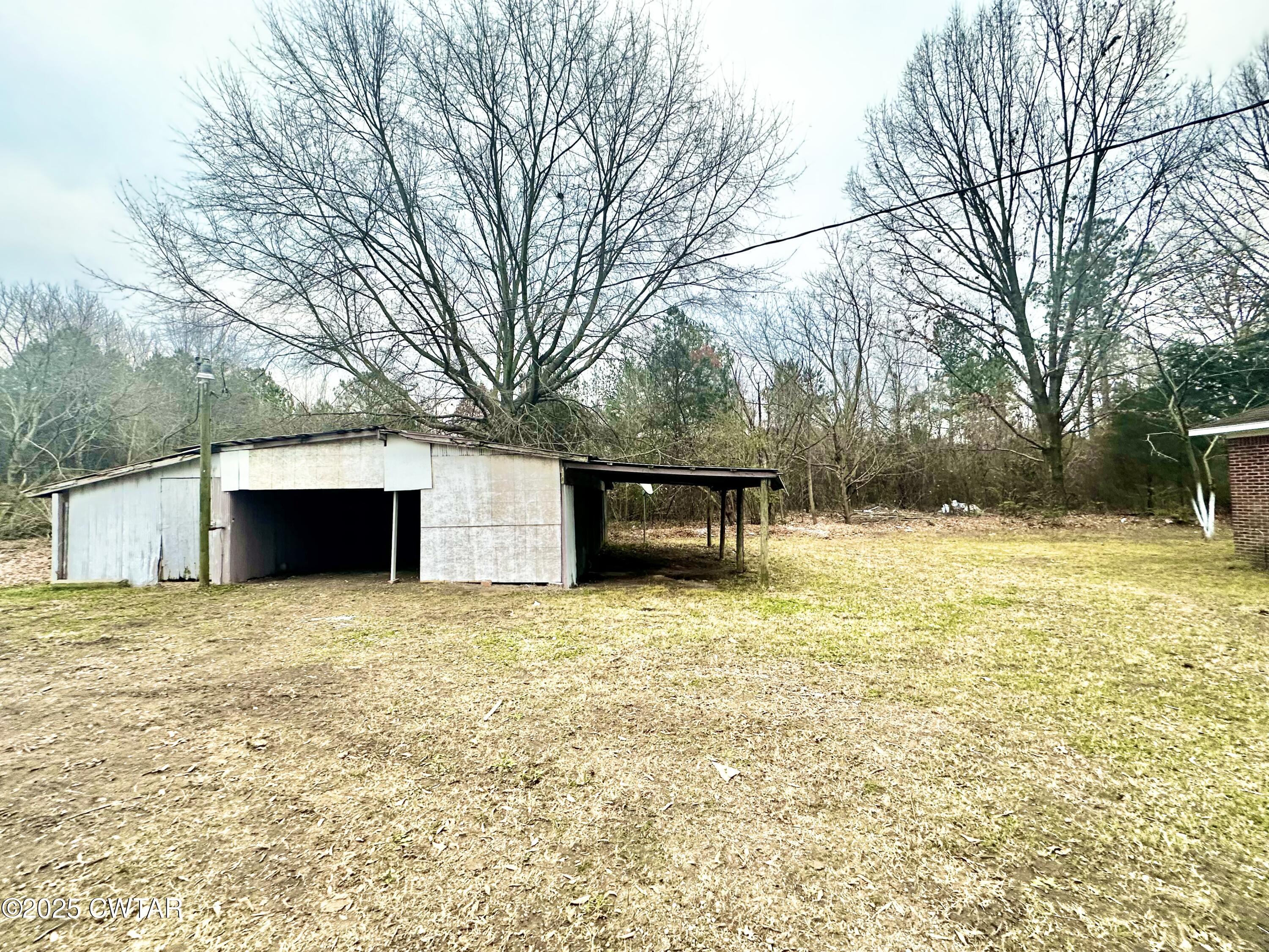 980 North Circle Road Memphis, TN 38127 - Photo 29 of 30 a front view of house with yard and trees in the background