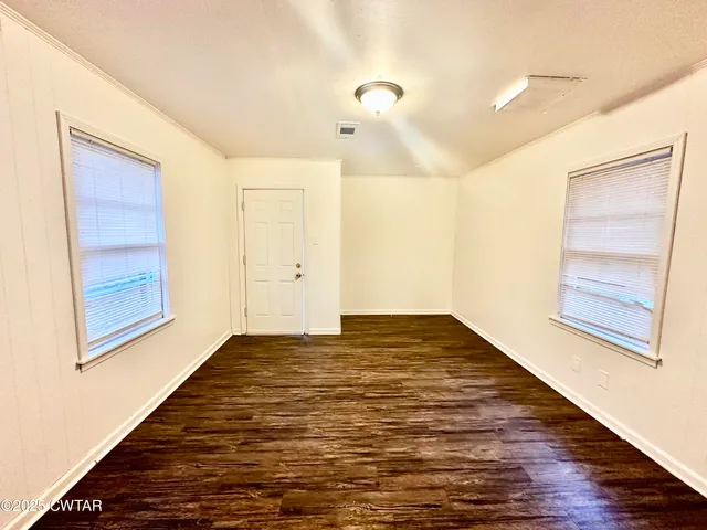 a view of an empty room and window