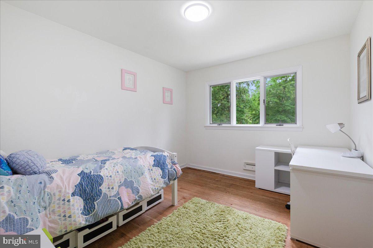 59 Longview Drive Princeton, NJ 08540 - Photo 16 of 30 a bedroom with a bed and a table in it