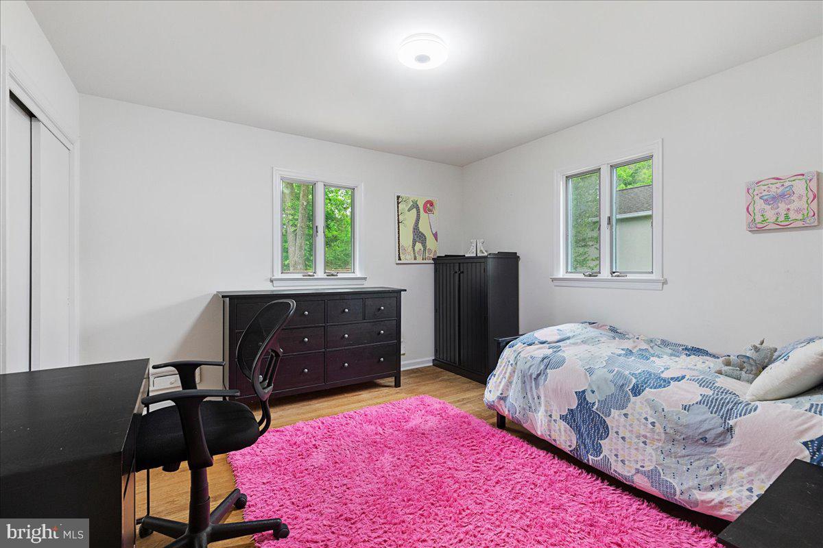 59 Longview Drive Princeton, NJ 08540 - Photo 17 of 30 a bedroom with a bed and a dresser