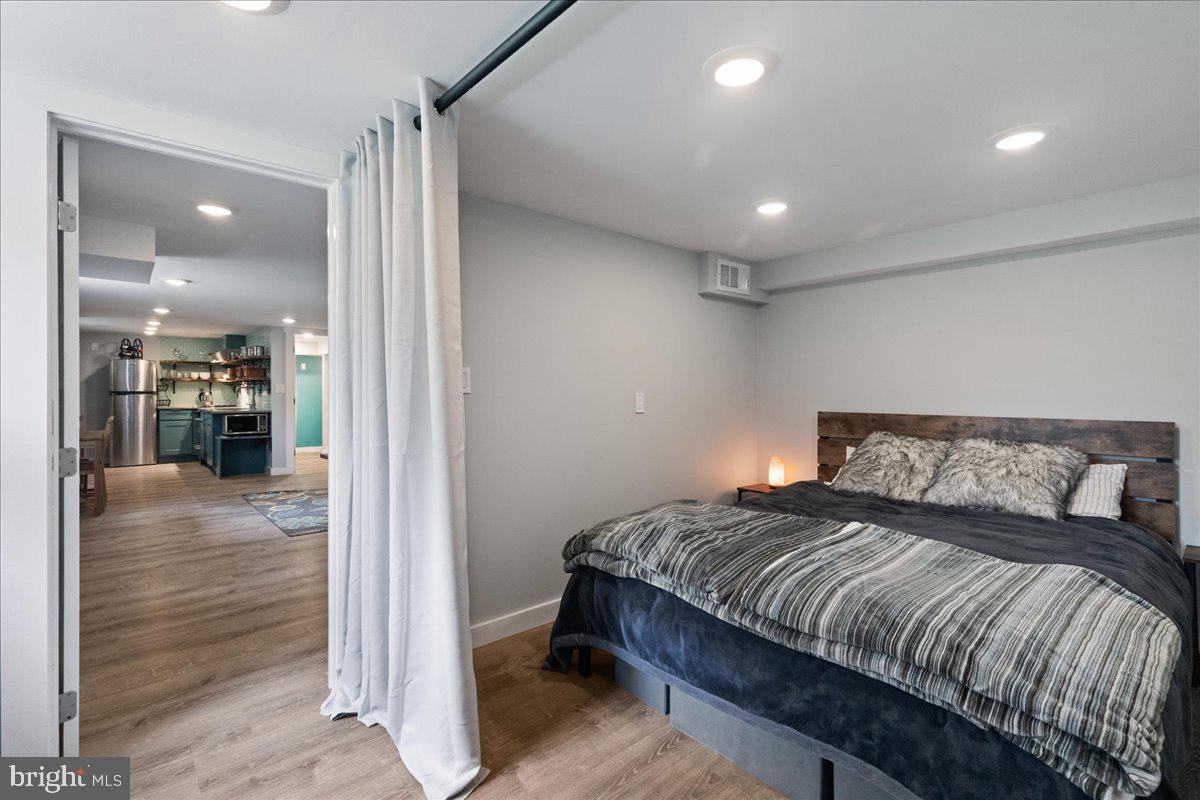 59 Longview Drive Princeton, NJ 08540 - Photo 21 of 30 a bedroom with a bed and a view of bathroom