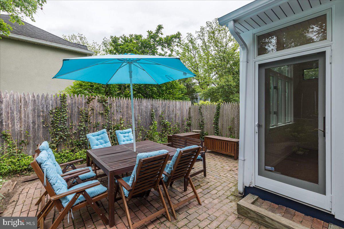 59 Longview Drive Princeton, NJ 08540 - Photo 23 of 30 a view of backyard with seating space and wooden fence
