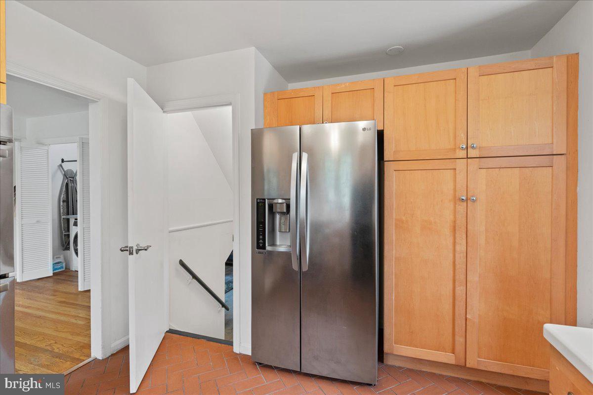 59 Longview Drive Princeton, NJ 08540 - Photo 9 of 30 a metallic refrigerator freezer sitting in a kitchen