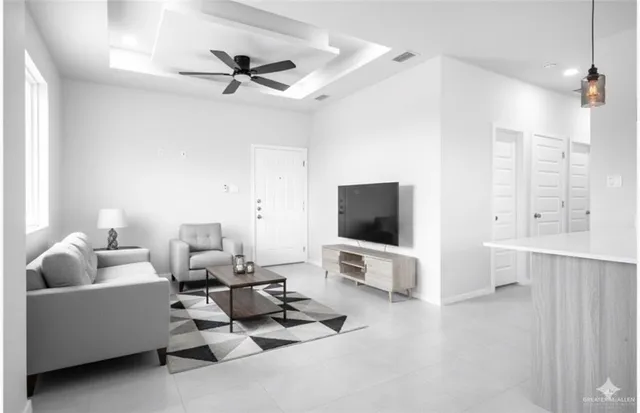 a living room with furniture and a flat screen tv