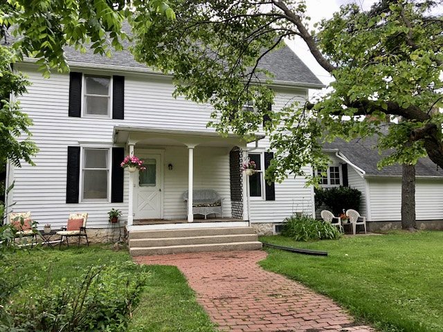 front view of a house with a yard