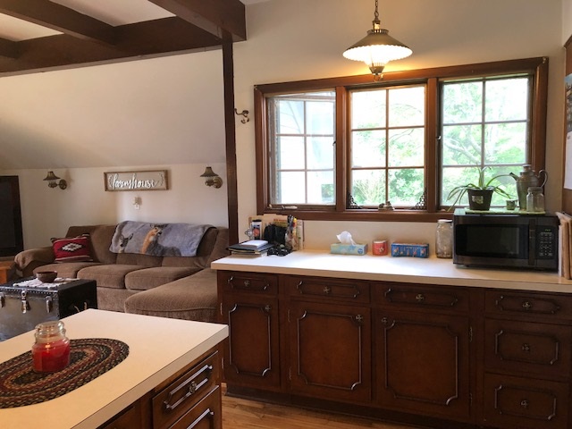 14964 Mill Road Capron, IL 61012 - Photo 11 of 25 a kitchen with a sink a stove and a microwave
