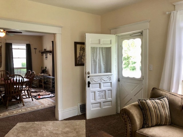 14964 Mill Road Capron, IL 61012 - Photo 16 of 25 a living room with furniture and a window