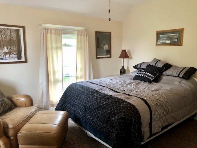14964 Mill Road Capron, IL 61012 - Photo 20 of 25 a bedroom with a bed and window