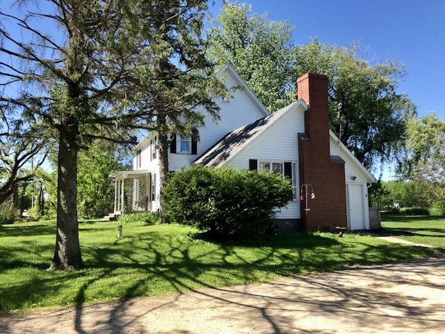 14964 Mill Road Capron, IL 61012 - Photo 2 of 25 a front view of house with a garden