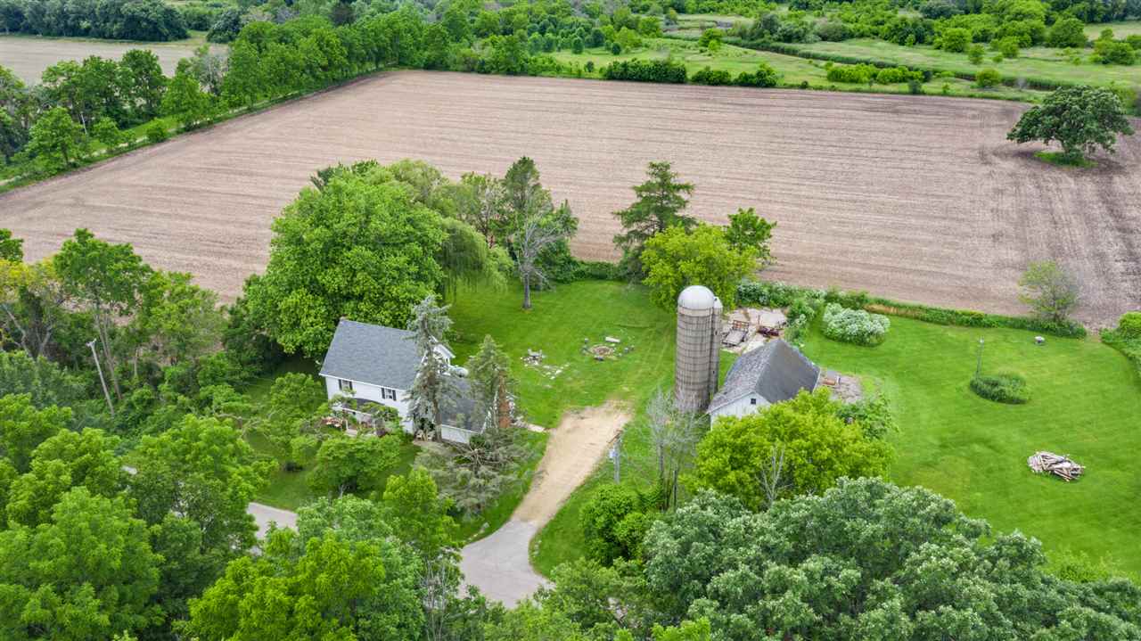 14964 Mill Road Capron, IL 61012 - Photo 3 of 25 a aerial view of a house with a yard and potted plants