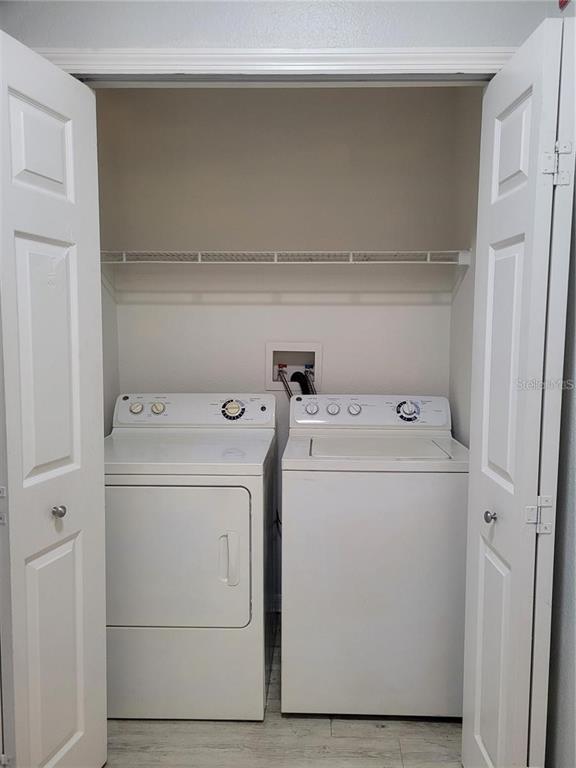 155 North Pearl Lake Causeway, Unit 200 Altamonte Springs, FL 32714 - Photo 16 of 21 a utility room with dryer and washer