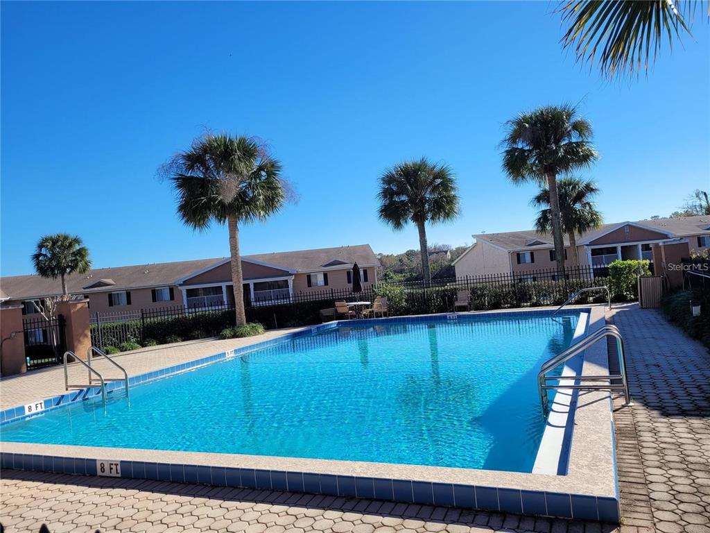 155 North Pearl Lake Causeway, Unit 200 Altamonte Springs, FL 32714 - Photo 17 of 21 a view of a house with a swimming pool