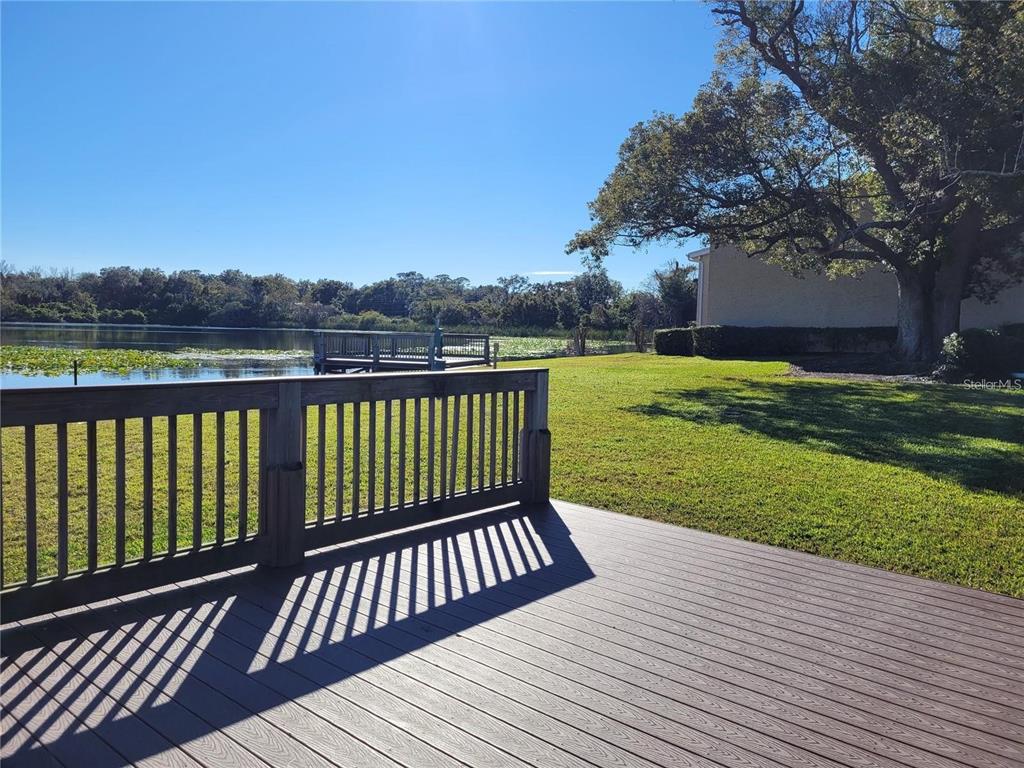 155 North Pearl Lake Causeway, Unit 200 Altamonte Springs, FL 32714 - Photo 21 of 21 a view of a wooden deck and a yard