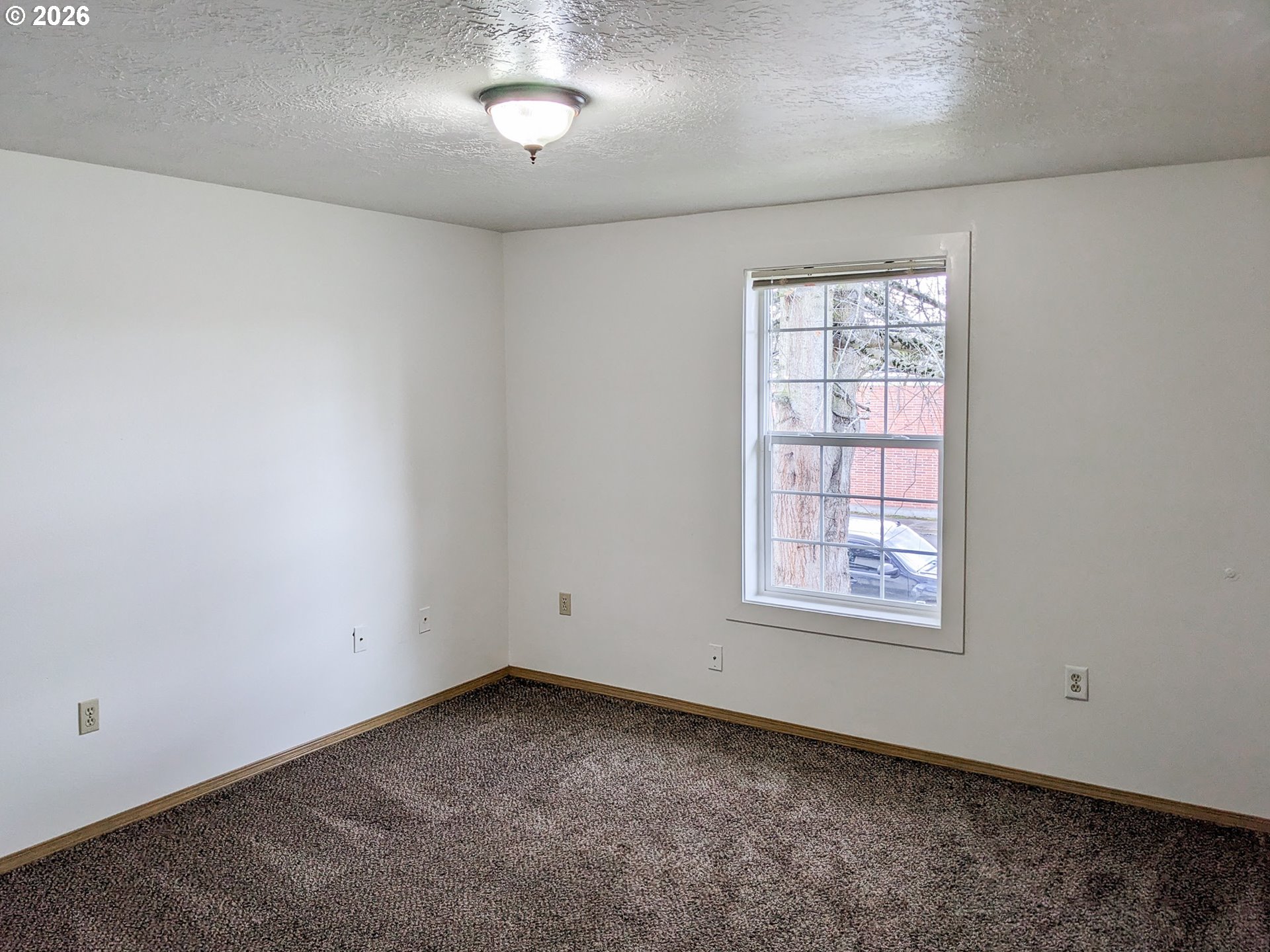 224 C Street Independence, OR 97351 - Photo 17 of 36 an empty room with a window