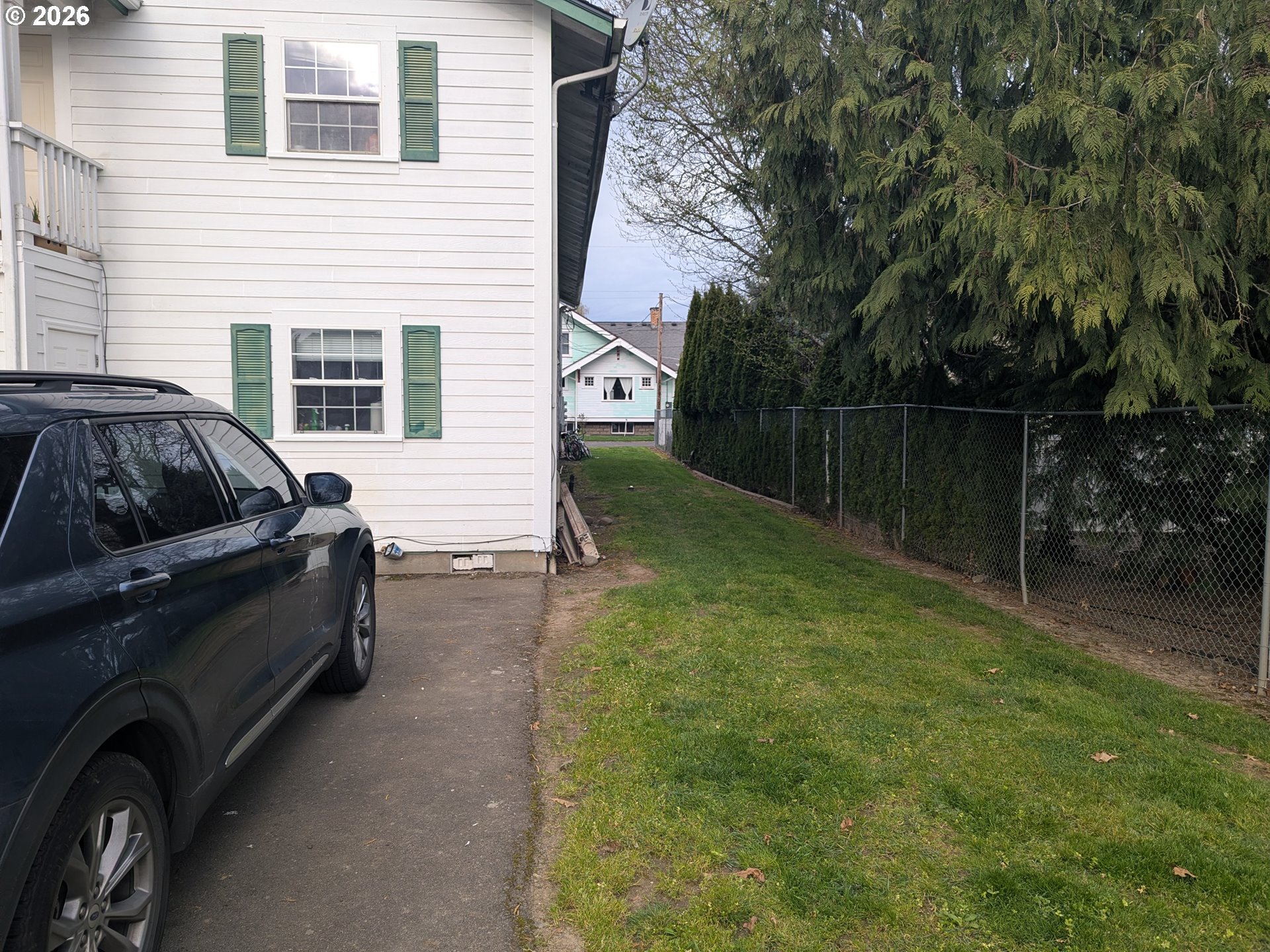 224 C Street Independence, OR 97351 - Photo 36 of 36 a view of backyard with barbeque grill and wooden fence