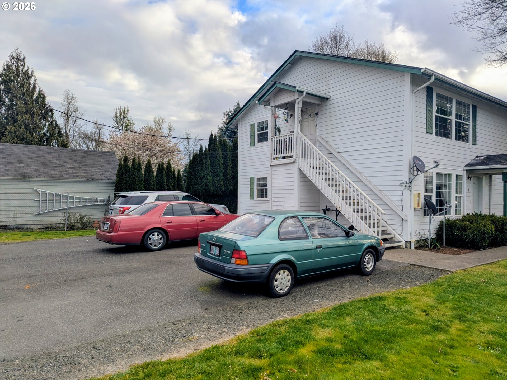224 C Street Independence, OR 97351 - Photo 4 of 36 a view of a cars parked in front of a house