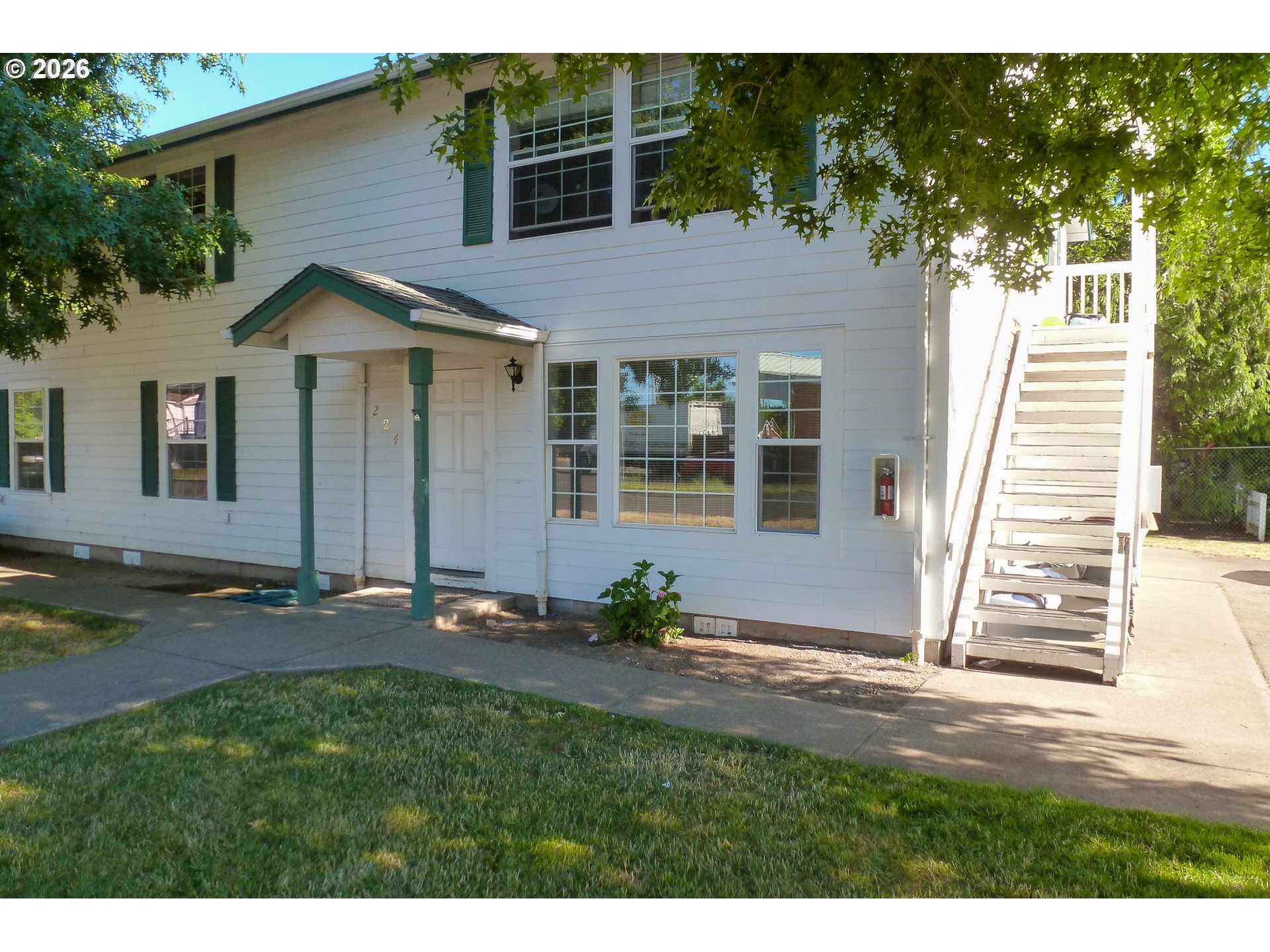 224 C Street Independence, OR 97351 - Photo 5 of 36 a backyard of a house with table and chairs