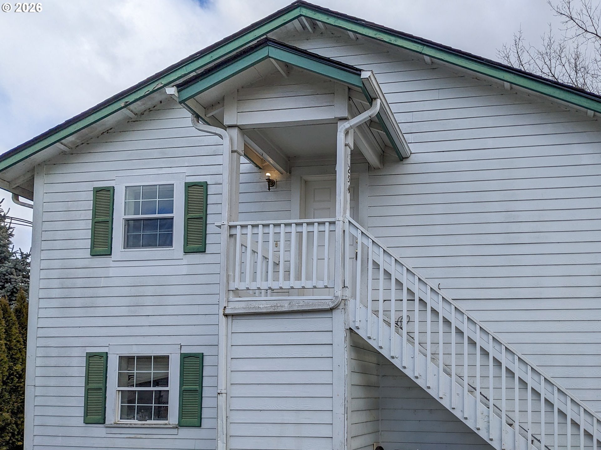 224 C Street Independence, OR 97351 - Photo 6 of 36 a view of wooden house with large windows