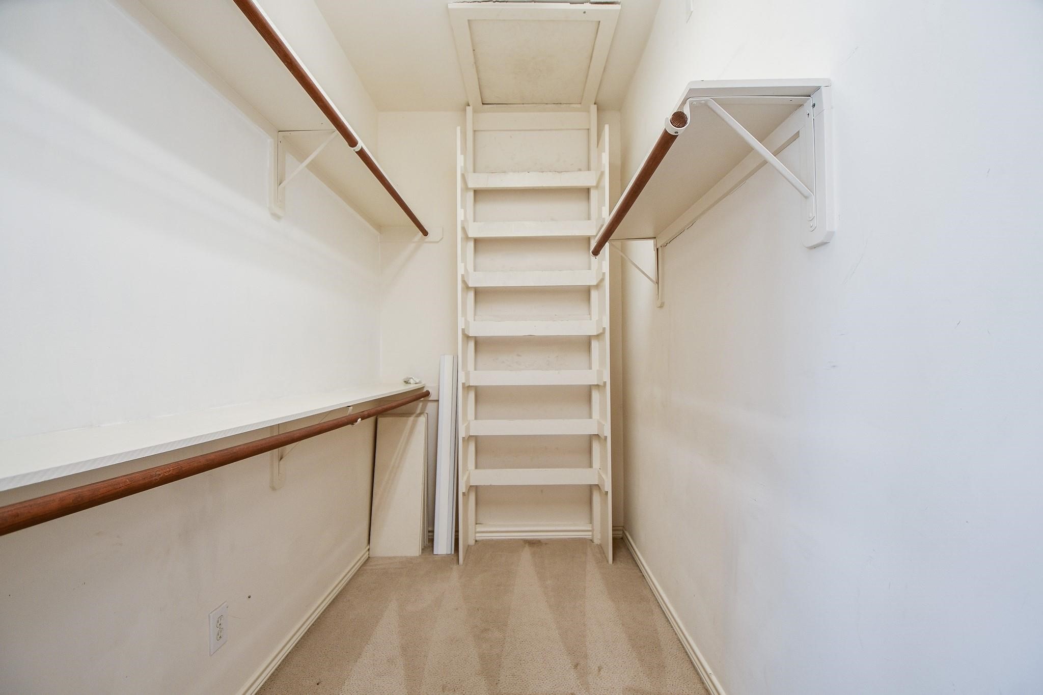 1025 Marconi Street Houston, TX 77019 - Photo 11 of 19 a view of walk in closet with empty racks