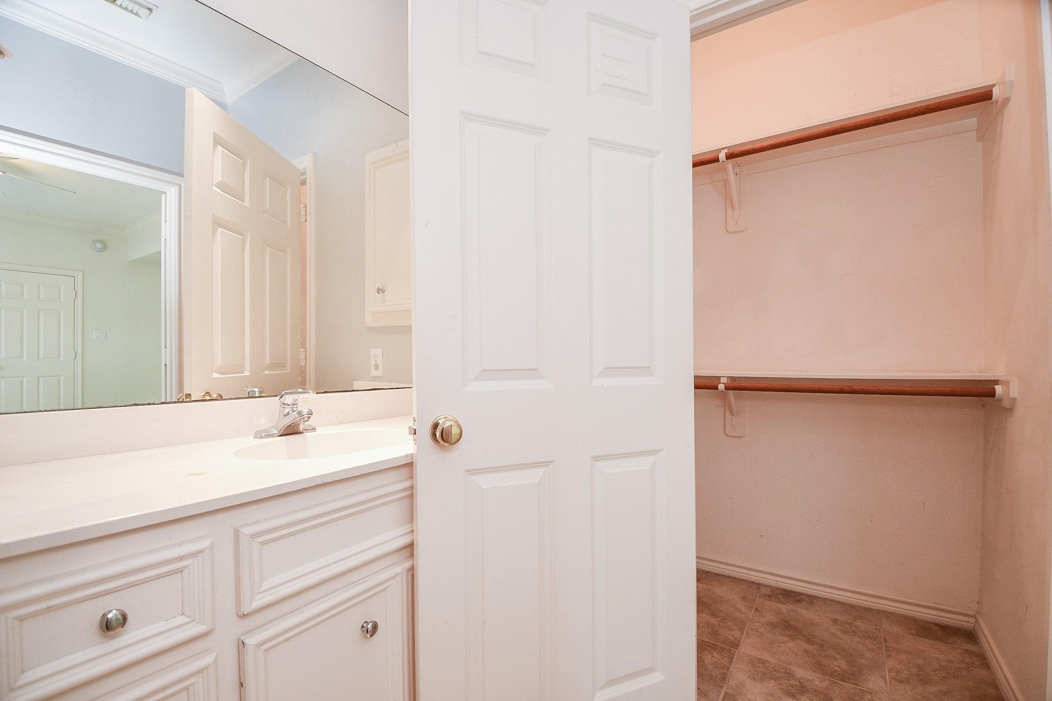 1025 Marconi Street Houston, TX 77019 - Photo 15 of 19 a bathroom with a sink and a mirror
