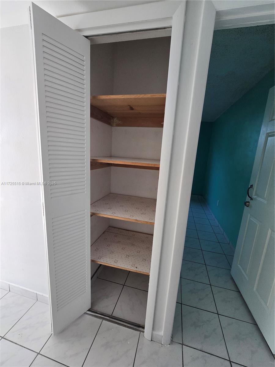 Fountainebleau Miami, FL 33172 - Photo 11 of 28 a view of walk in closet with empty racks