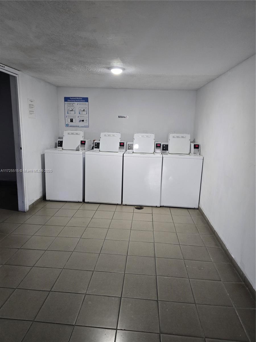 Fountainebleau Miami, FL 33172 - Photo 25 of 28 a view of a livingroom with washer and dryer