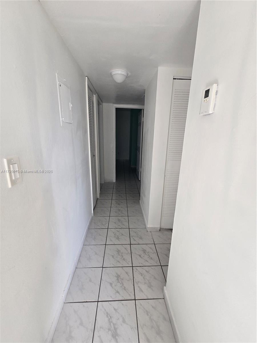 Fountainebleau Miami, FL 33172 - Photo 6 of 28 a view of a closet area in a room