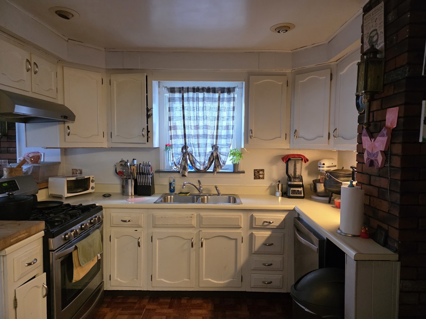 4310 North Central Park Avenue Chicago, IL 60618 - Photo 7 of 15 a kitchen with a sink cabinets and window