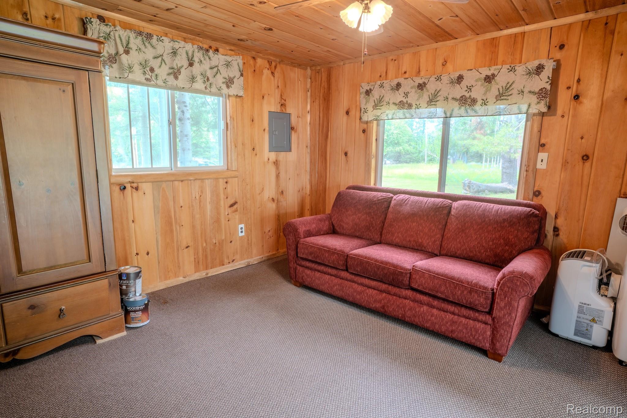 4350 Shrew Road Lincoln, MI 48742 - Photo 23 of 32 Interior space featuring wood-paneled walls and a wood-paneled ceiling