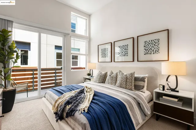 a bedroom with a bed and a night stand