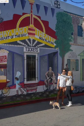 a front view of a building with retail shop and windows