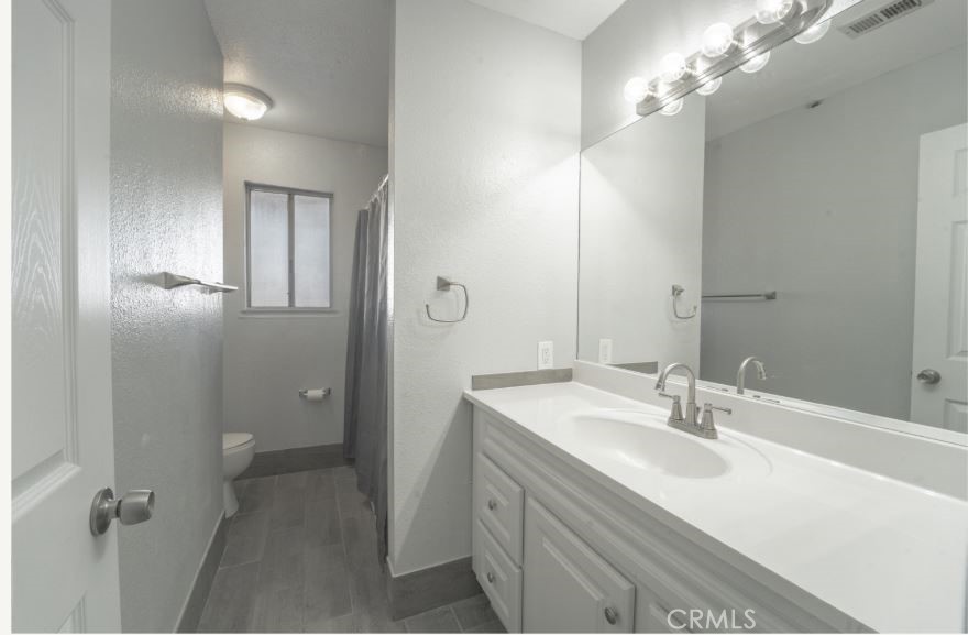 15032 Birch Street Hesperia, CA 92345 - Photo 12 of 21 a bathroom with a sink double vanity and a mirror